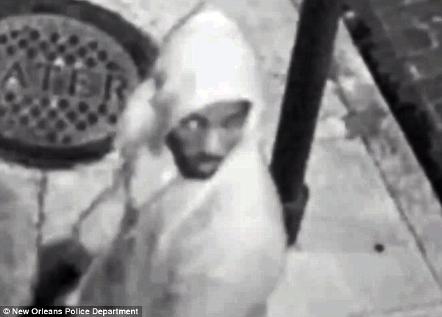 The suspect (pictured above) was described as a black male wearing a dark colored hooded sweatshirt